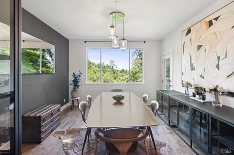 a kitchen with stainless steel appliances granite countertop a sink and a refrigerator
