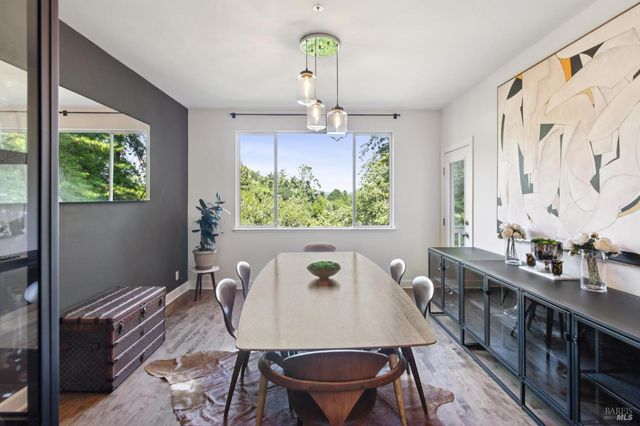a kitchen with stainless steel appliances granite countertop a sink and a refrigerator