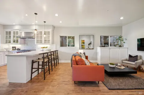 a bedroom with furniture and a potted plant