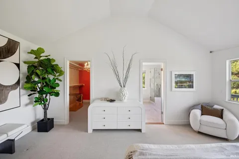 a view of a balcony with wooden floor and fence