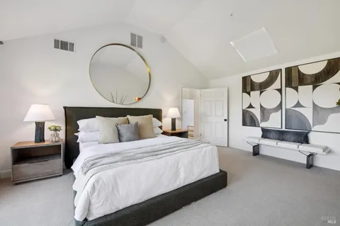 a bedroom with bed and a window