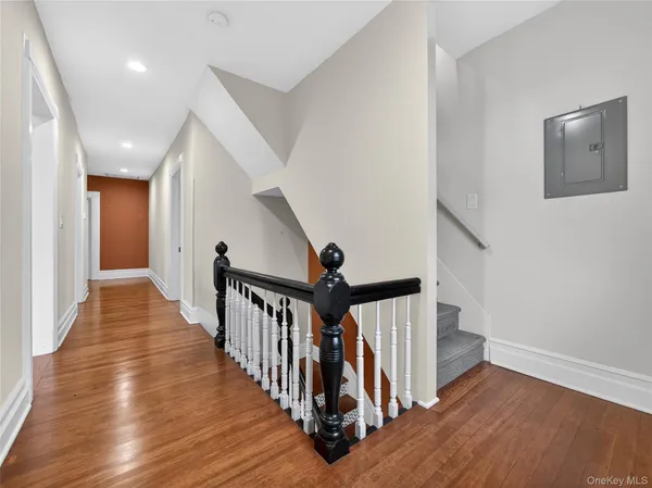 a view of entryway with wooden floor