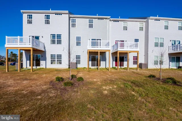 a front view of a building with a street