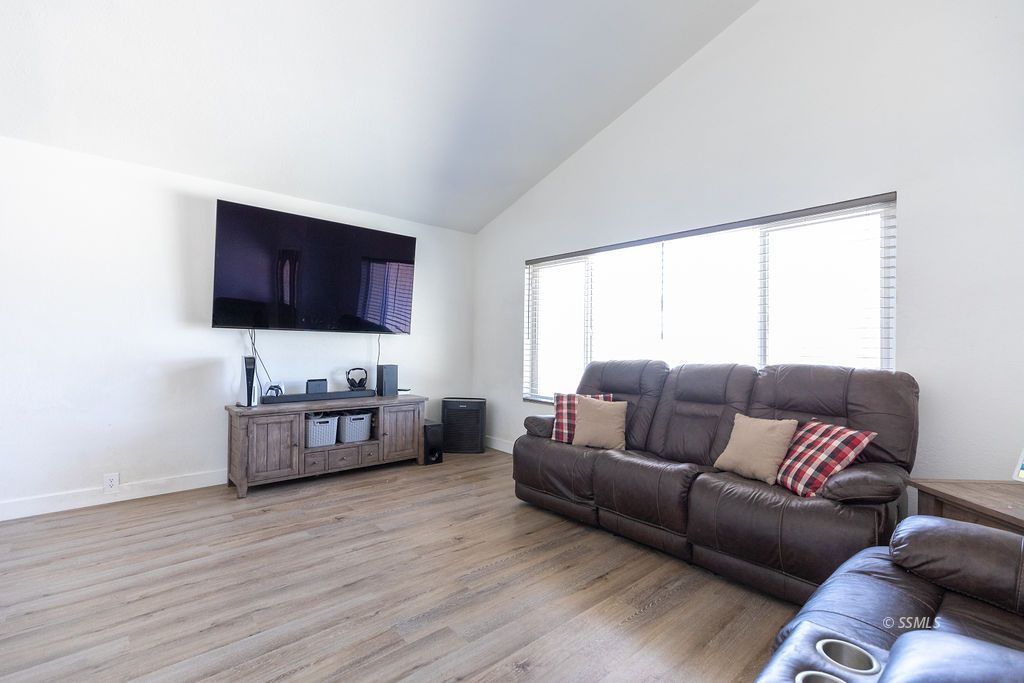 538 North Rio Bravo Street Ridgecrest, CA 93555 - Photo 6 of 45 a living room with furniture and a flat screen tv