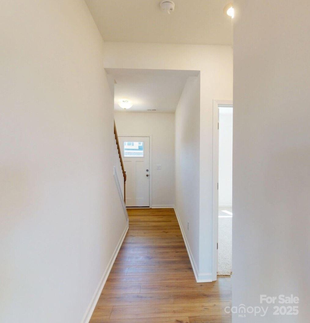 1829 Augustine Street Monroe, NC 28112 - Photo 3 of 21 a view of a hallway with wooden floor