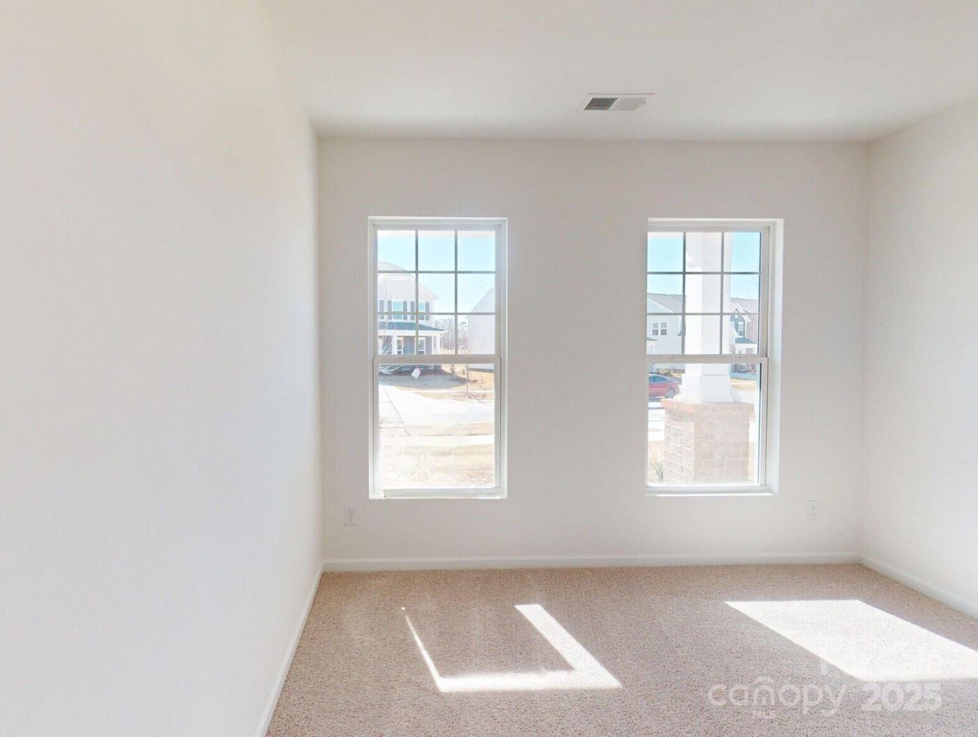 1829 Augustine Street Monroe, NC 28112 - Photo 4 of 21 an empty room with windows