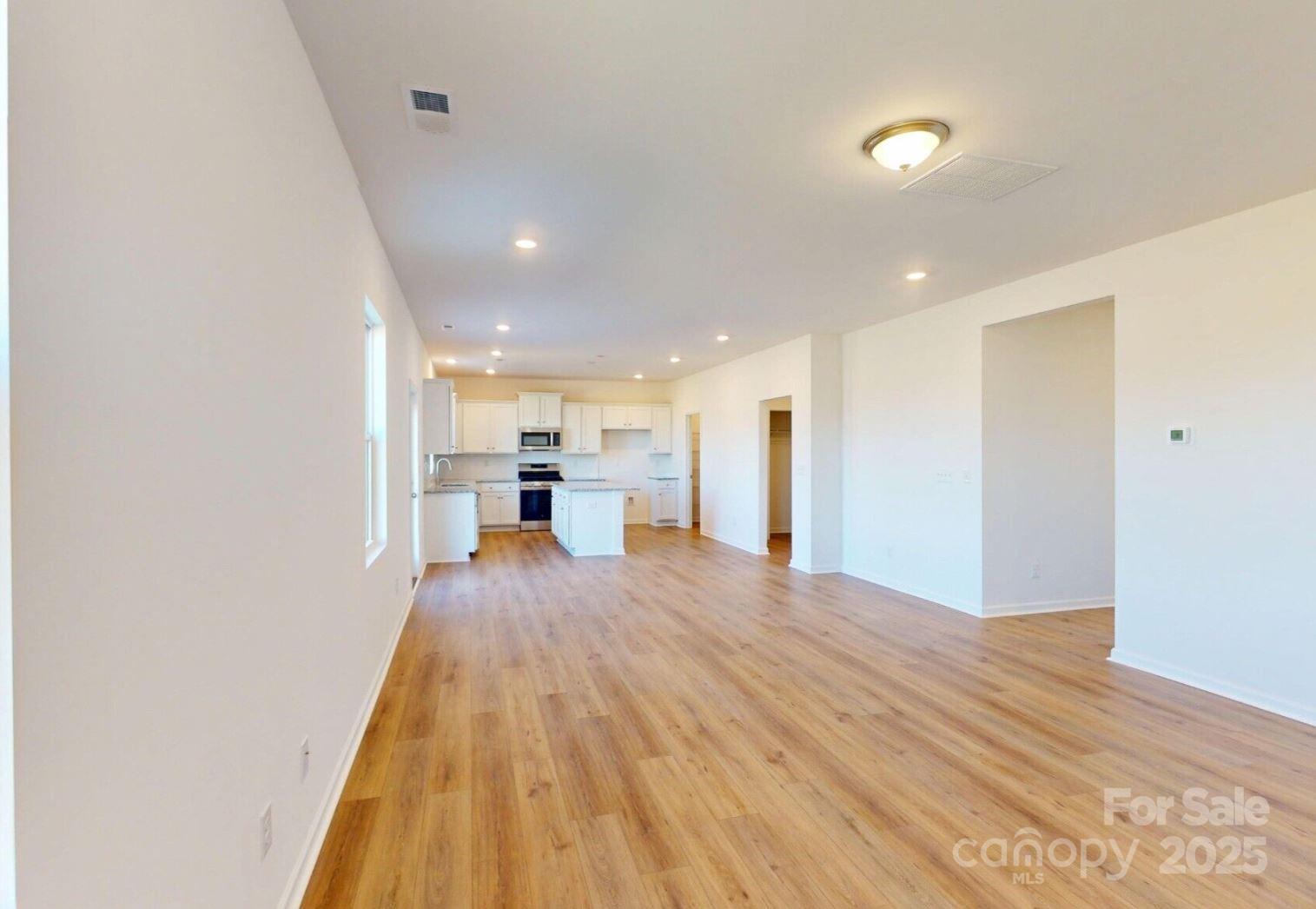 1829 Augustine Street Monroe, NC 28112 - Photo 8 of 21 a view of kitchen and wooden floor