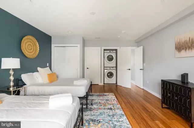 a living room with furniture and a rug