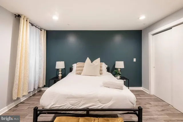 a bedroom with a bed and a window