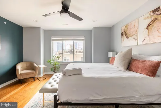 a bedroom with a bed and a window