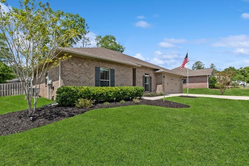 4542 Annabelle Lane Crestview, FL 32539 - Photo 2 of 36 a front view of a house with a yard