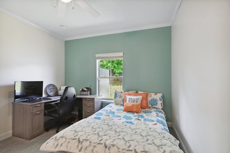 4542 Annabelle Lane Crestview, FL 32539 - Photo 23 of 36 a bedroom with a bed and a tv