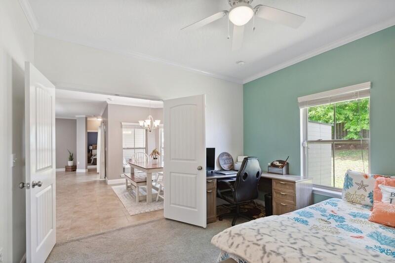 4542 Annabelle Lane Crestview, FL 32539 - Photo 24 of 36 a bedroom with furniture and a chandelier