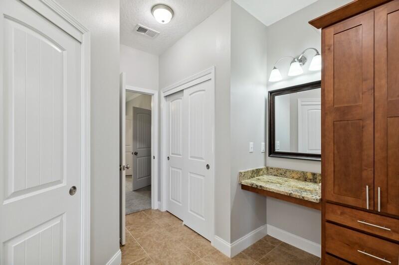 4542 Annabelle Lane Crestview, FL 32539 - Photo 31 of 36 a bathroom with a granite countertop sink and a mirror
