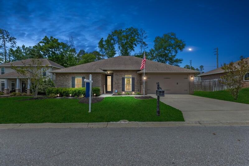 4542 Annabelle Lane Crestview, FL 32539 - Photo 35 of 36 a front view of a house with a garden