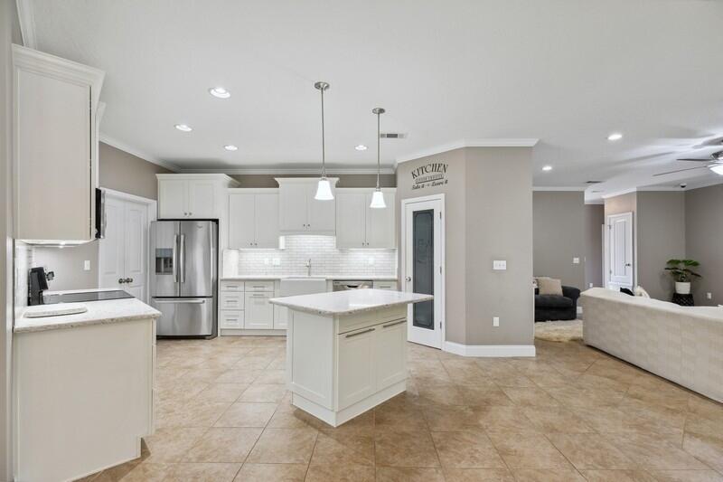 4542 Annabelle Lane Crestview, FL 32539 - Photo 10 of 36 a large kitchen with a lot of counter space and refrigerator