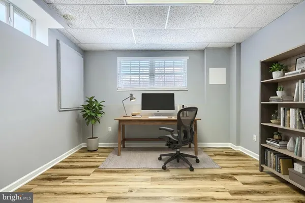 a workspace with furniture and a potted plant