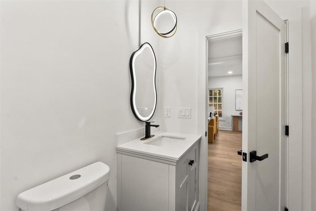 5580 Burrus Road Austell, GA 30106 - Photo 44 of 53 a bathroom with a toilet sink and shower