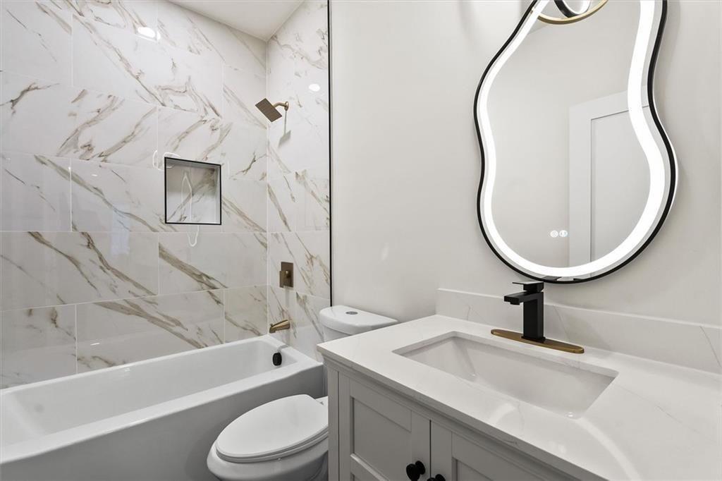 5580 Burrus Road Austell, GA 30106 - Photo 45 of 53 a bathroom with a sink toilet and shower