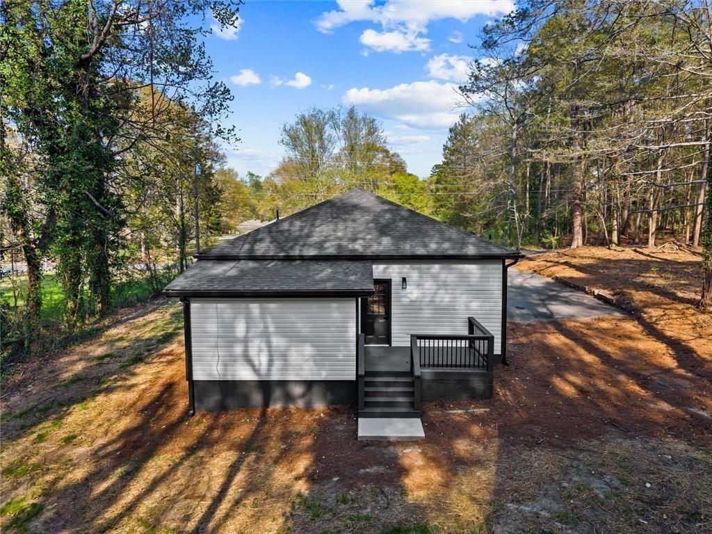 5580 Burrus Road Austell, GA 30106 - Photo 47 of 53 a front view of a house with a yard