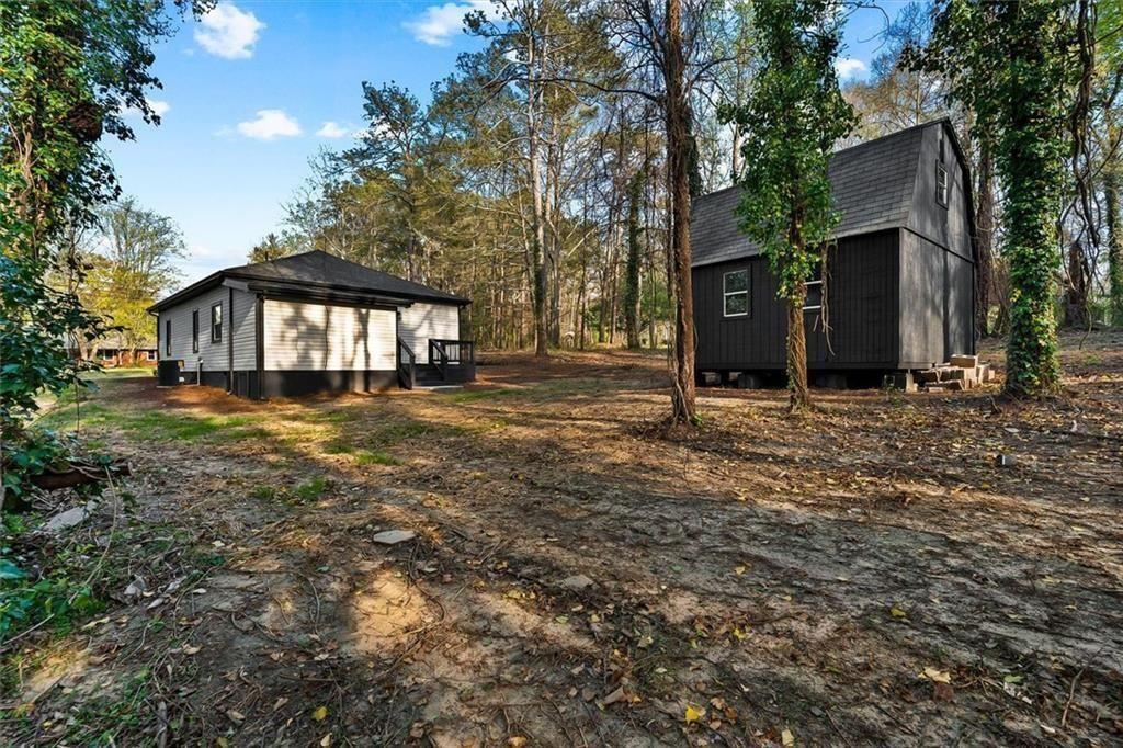 5580 Burrus Road Austell, GA 30106 - Photo 49 of 53 a view of a house with yard and sitting area