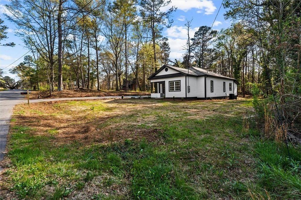 5580 Burrus Road Austell, GA 30106 - Photo 5 of 53 a view of a house with a yard