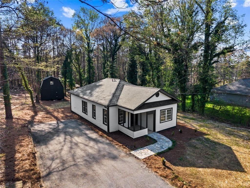 5580 Burrus Road Austell, GA 30106 - Photo 9 of 53 a aerial view of a house with a yard patio and deck