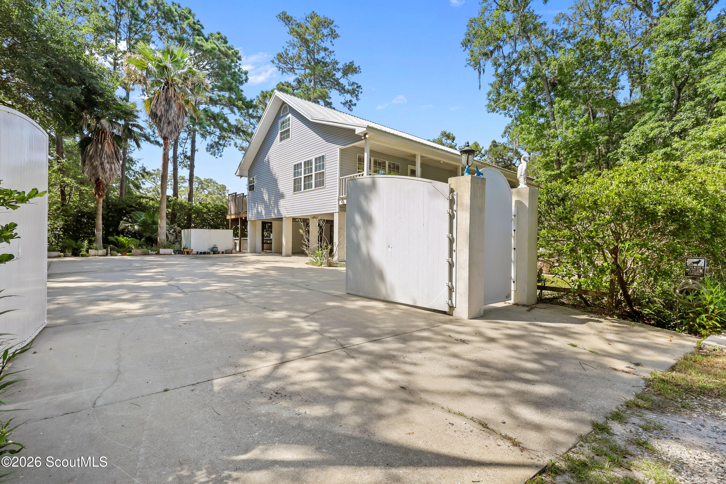 104 Sapelo Street St. Simons Island, GA 31522 - Photo 1 of 45 Private Gated Entrance