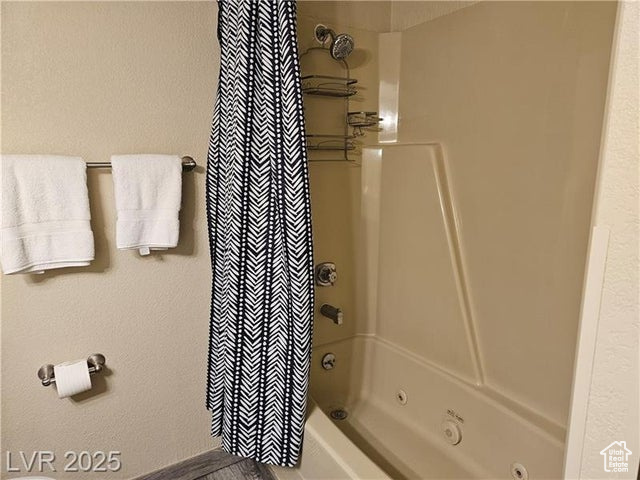 223 Hunter Ridge Drive, Unit E121 Brian Head, UT 84719 - Photo 9 of 35 Bathroom featuring shower / bath combination with curtain
