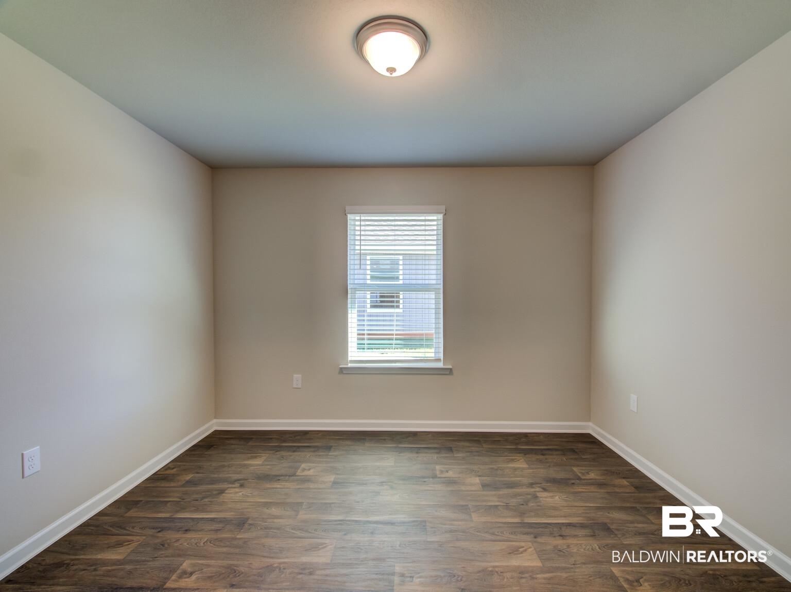 23952 Citation Loop Daphne, AL 36526 - Photo 28 of 69 Empty room with dark wood-type flooring and baseboards