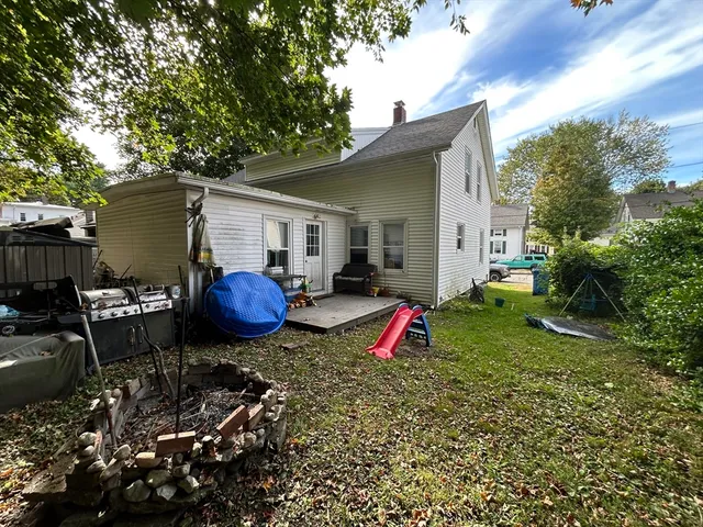 a kitchen with kitchen island a stove top oven a sink and a refrigerator