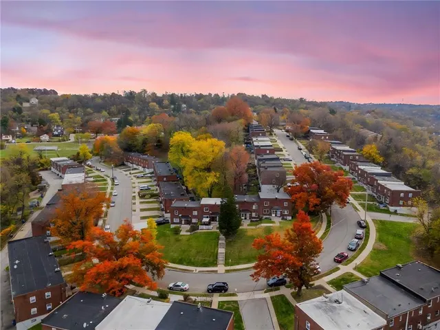 an aerial view of residential house with outdoor space and swimming pool