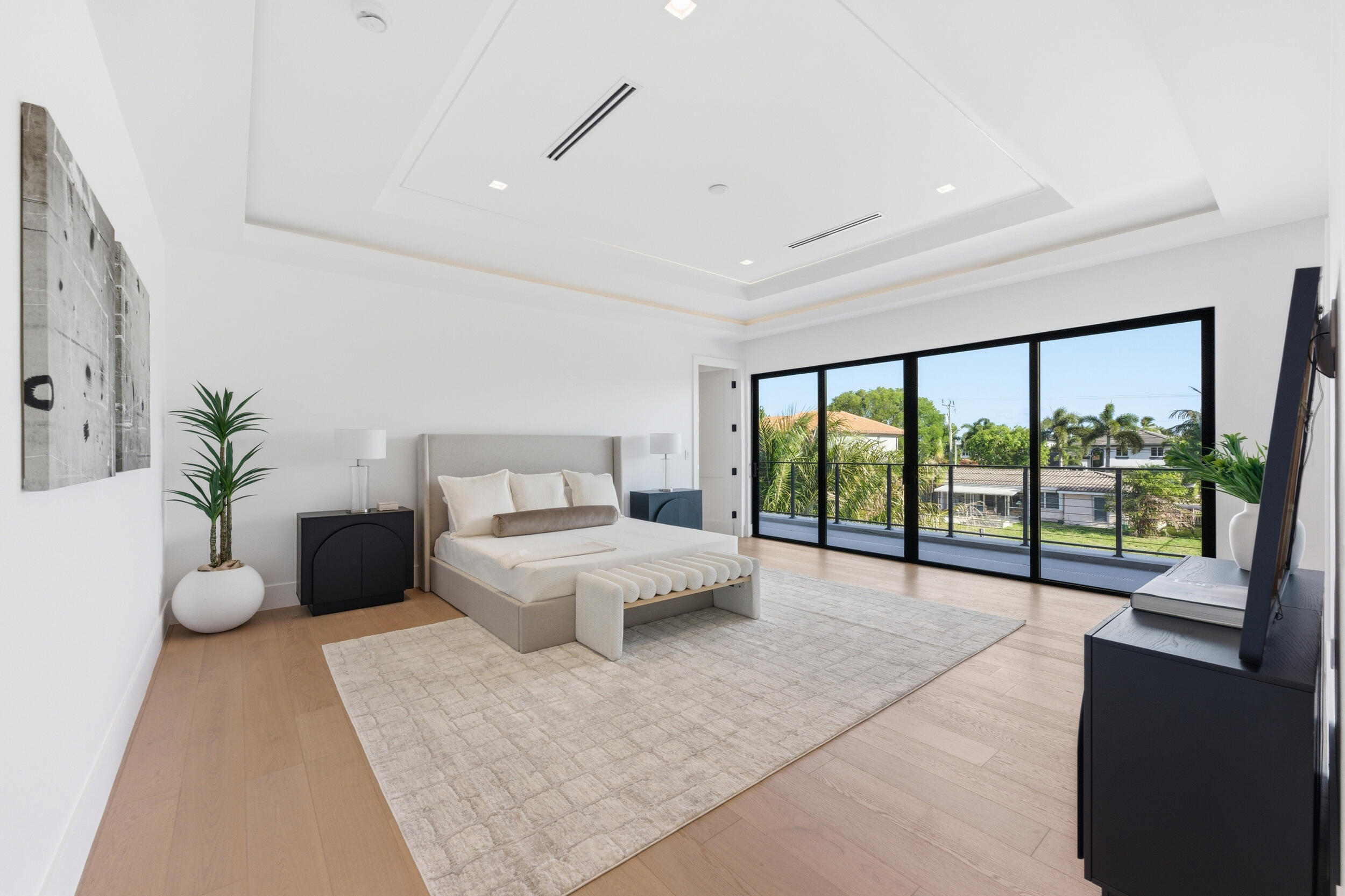2360 Northeast 49th Street Lighthouse Point, FL 33064 - Photo 39 of 66 a spacious bedroom with a large bed and a large window