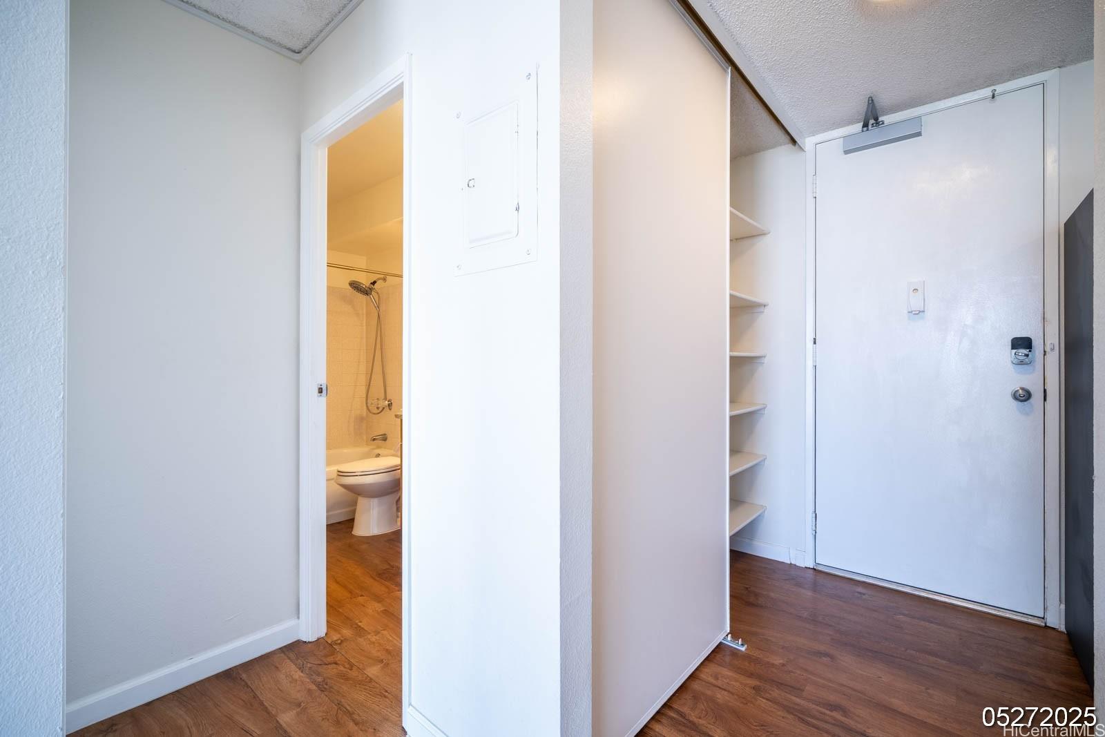 98-99 Uao Place, Unit 1705 Aiea, HI 96701 - Photo 14 of 25 a view of closet area with wooden floor
