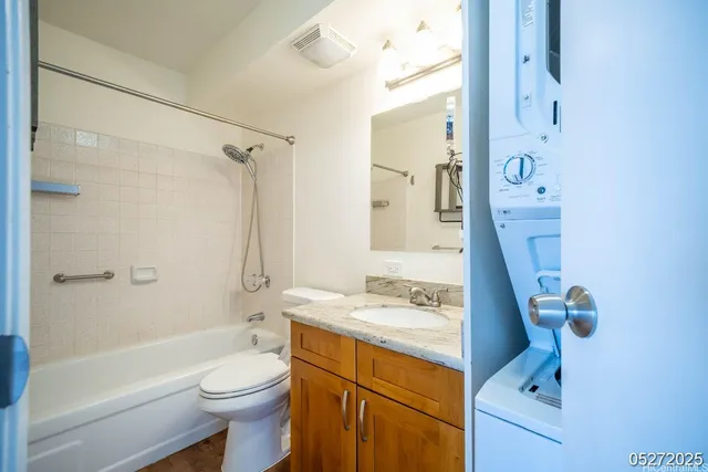 a bathroom with a sink toilet tub and shower
