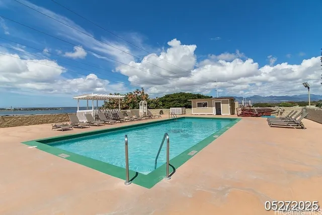 a view of a swimming pool with a yard
