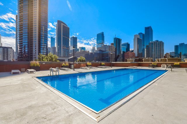 400 North Clinton Street, Unit 507 Chicago, IL 60654 - Photo 19 of 31 a view of a swimming pool with outdoor seating
