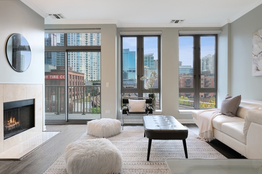 400 North Clinton Street, Unit 507 Chicago, IL 60654 - Photo 2 of 31 a living room with furniture and a fireplace