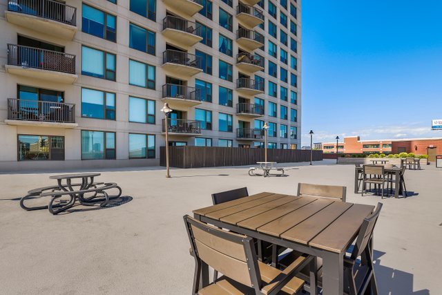 400 North Clinton Street, Unit 507 Chicago, IL 60654 - Photo 21 of 31 a view of a building and dining table with chairs