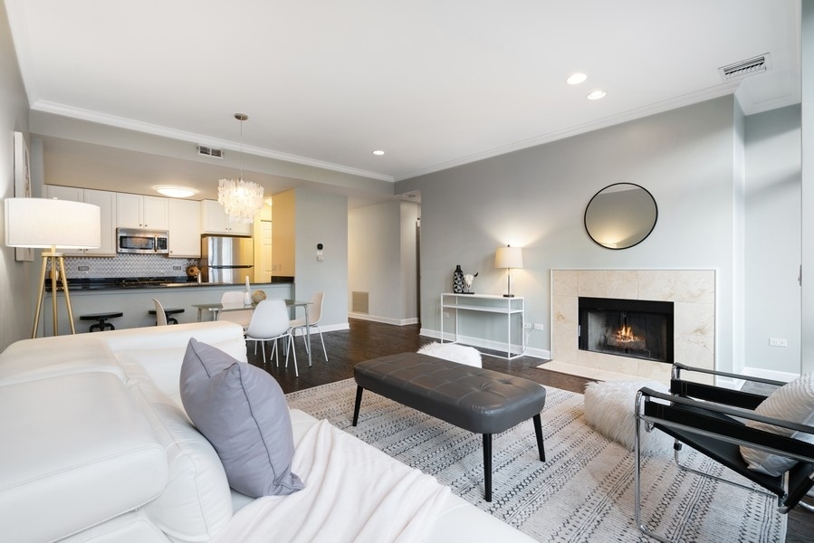 400 North Clinton Street, Unit 507 Chicago, IL 60654 - Photo 5 of 31 a living room with furniture and a fireplace