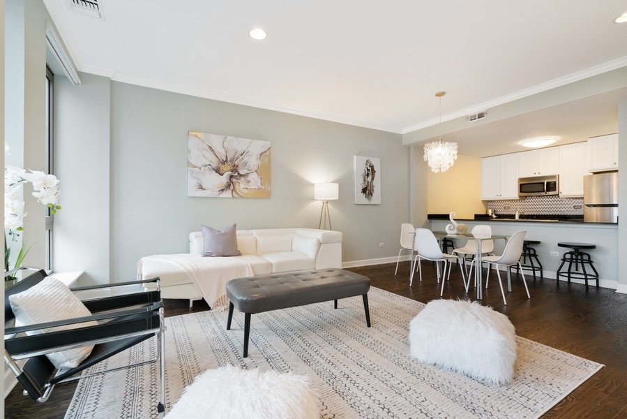 400 North Clinton Street, Unit 507 Chicago, IL 60654 - Photo 6 of 31 a living room with furniture and a wooden floor