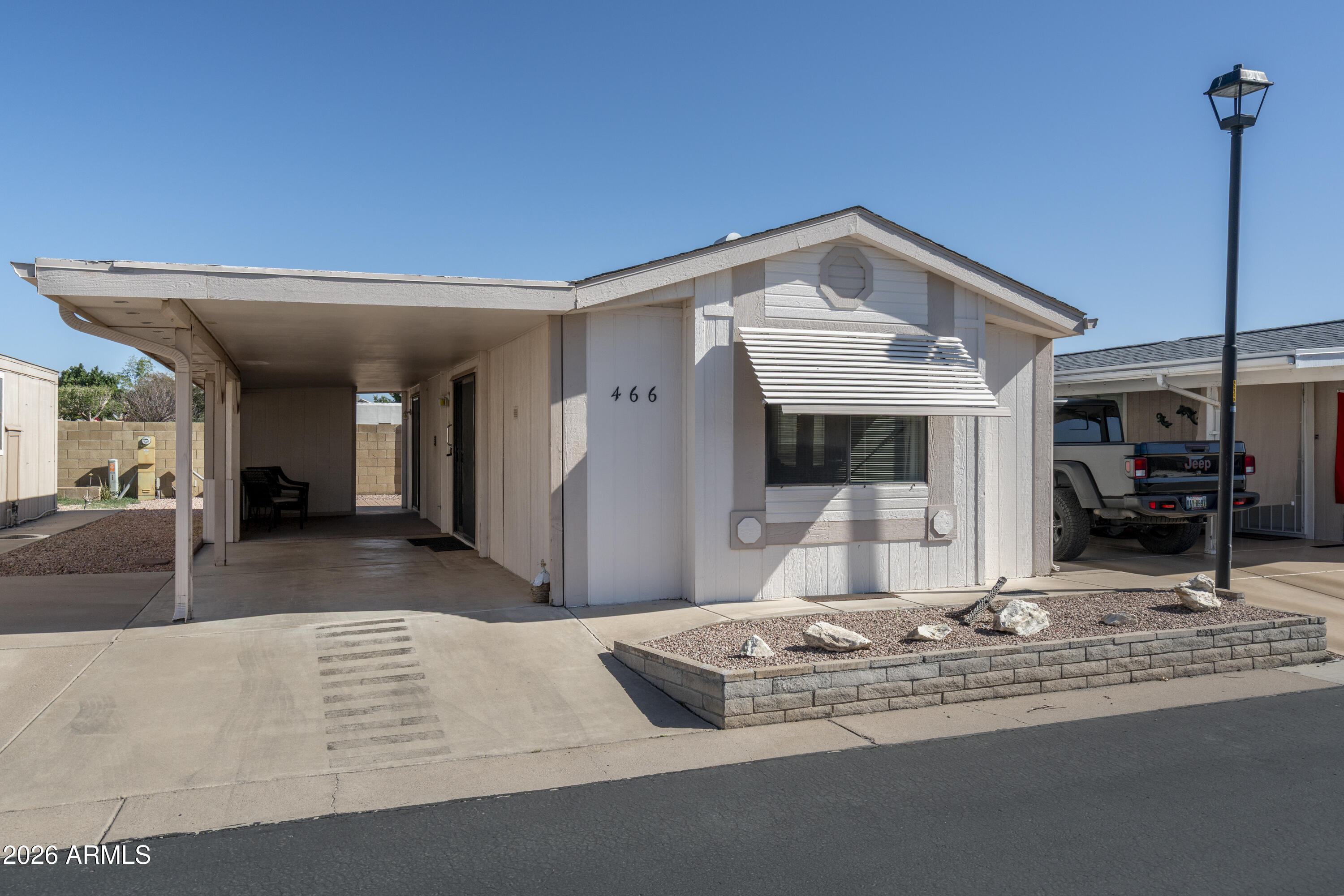 a view of a living room with a fireplace furniture and a large window