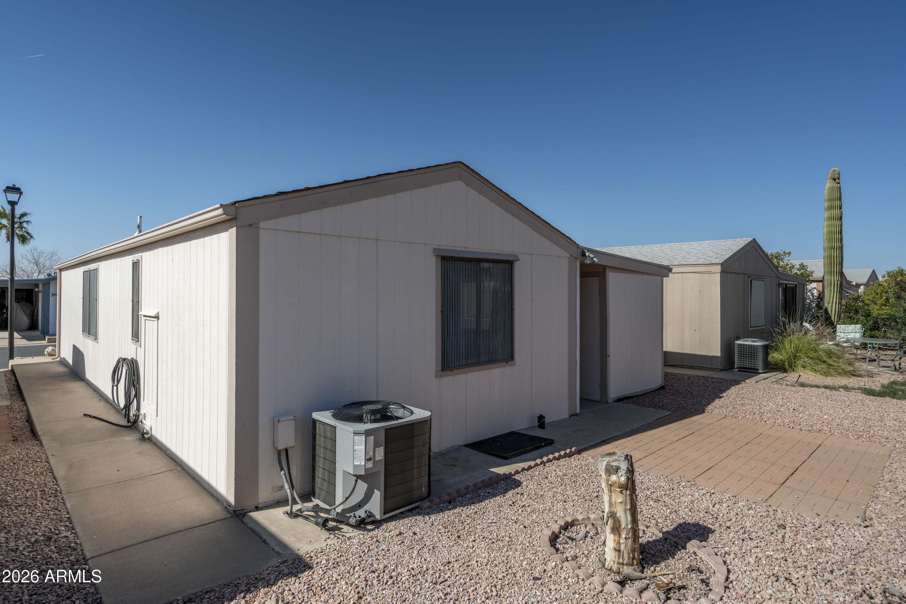5735 East McDowell Road, Unit 466 Mesa, AZ 85215 - Photo 15 of 19 a house view with a backyard