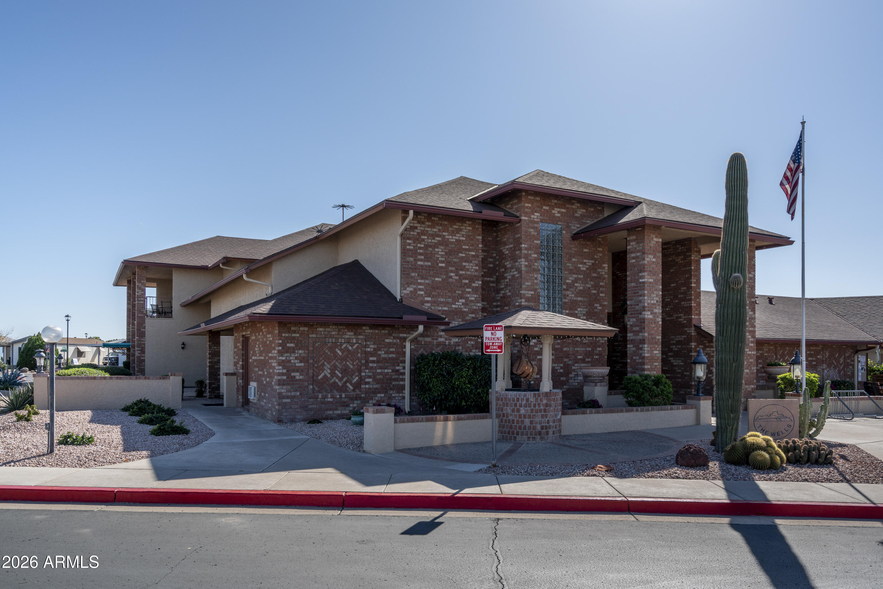 5735 East McDowell Road, Unit 466 Mesa, AZ 85215 - Photo 19 of 19 a front view of a house with garden