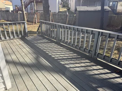 a view of balcony with wooden floor