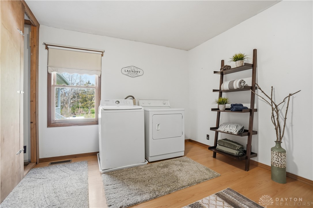 7553 Coffin Station Road Springfield, OH 45502 - Photo 60 of 95 This dedicated laundry room provides convenience and a bright, functional space.
