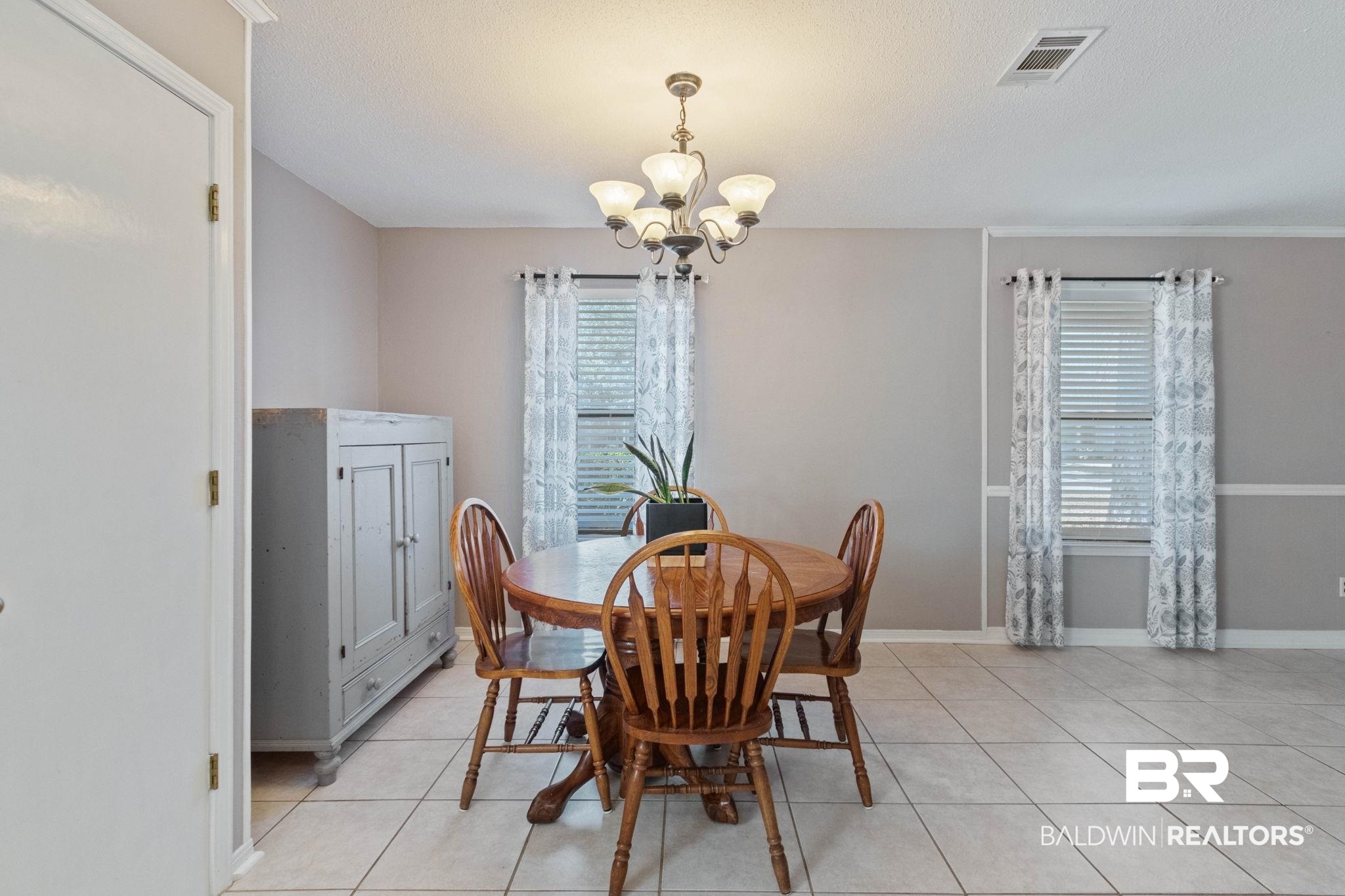 5366 Scanlan Way West Satsuma, AL 36572 - Photo 12 of 43 Dining space featuring hanging lights and light tile patterned floors