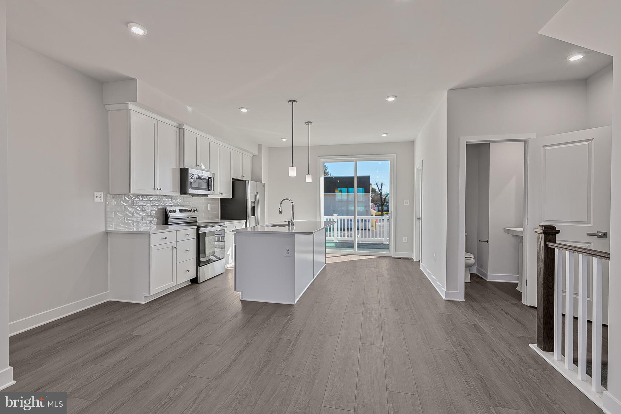 70 C Oasis Avenue Ranson, WV 25438 - Photo 18 of 41 a kitchen with white cabinets and stainless steel appliances