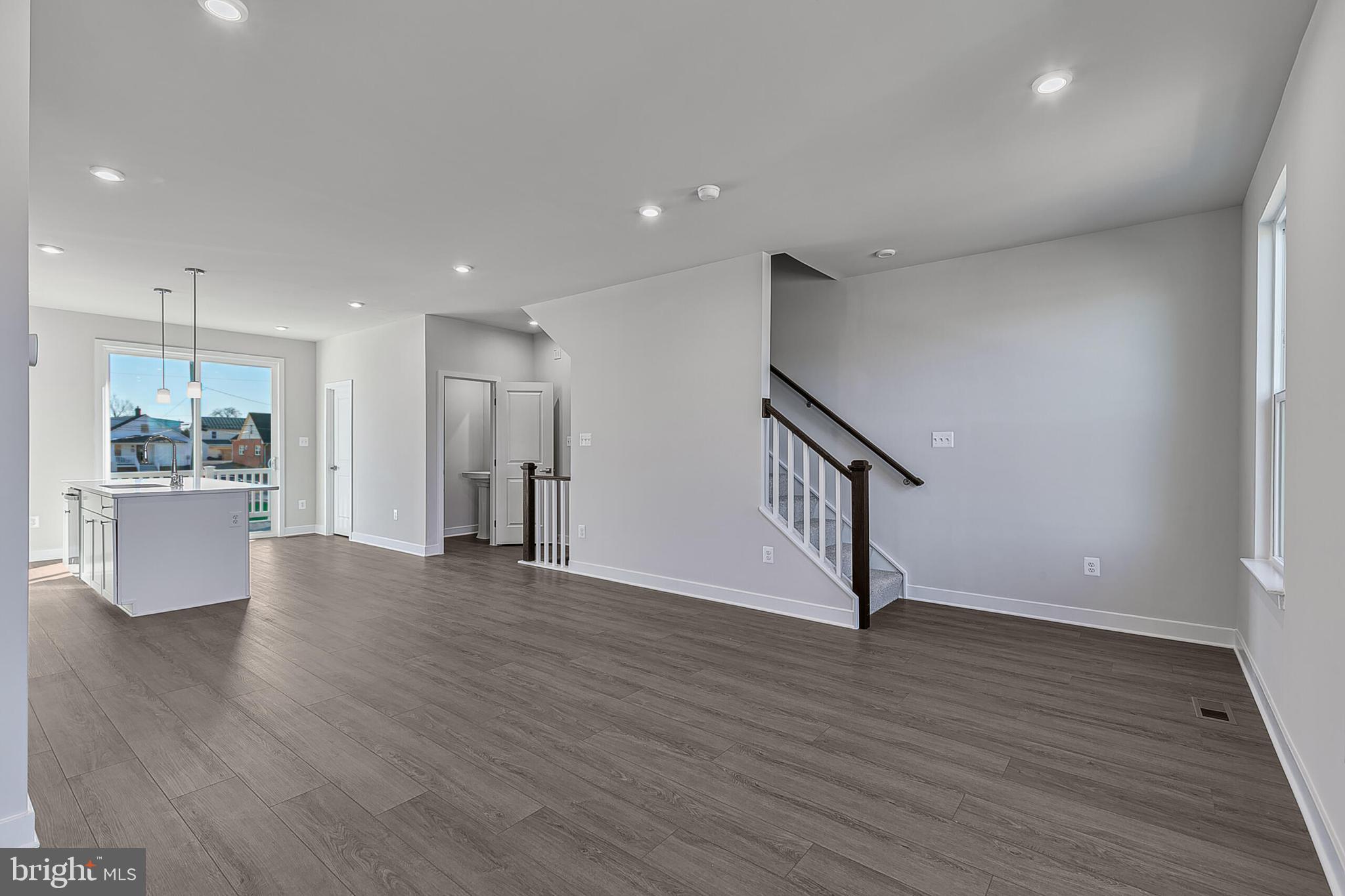 70 C Oasis Avenue Ranson, WV 25438 - Photo 19 of 41 a view of an empty room with wooden floor and a cabinet