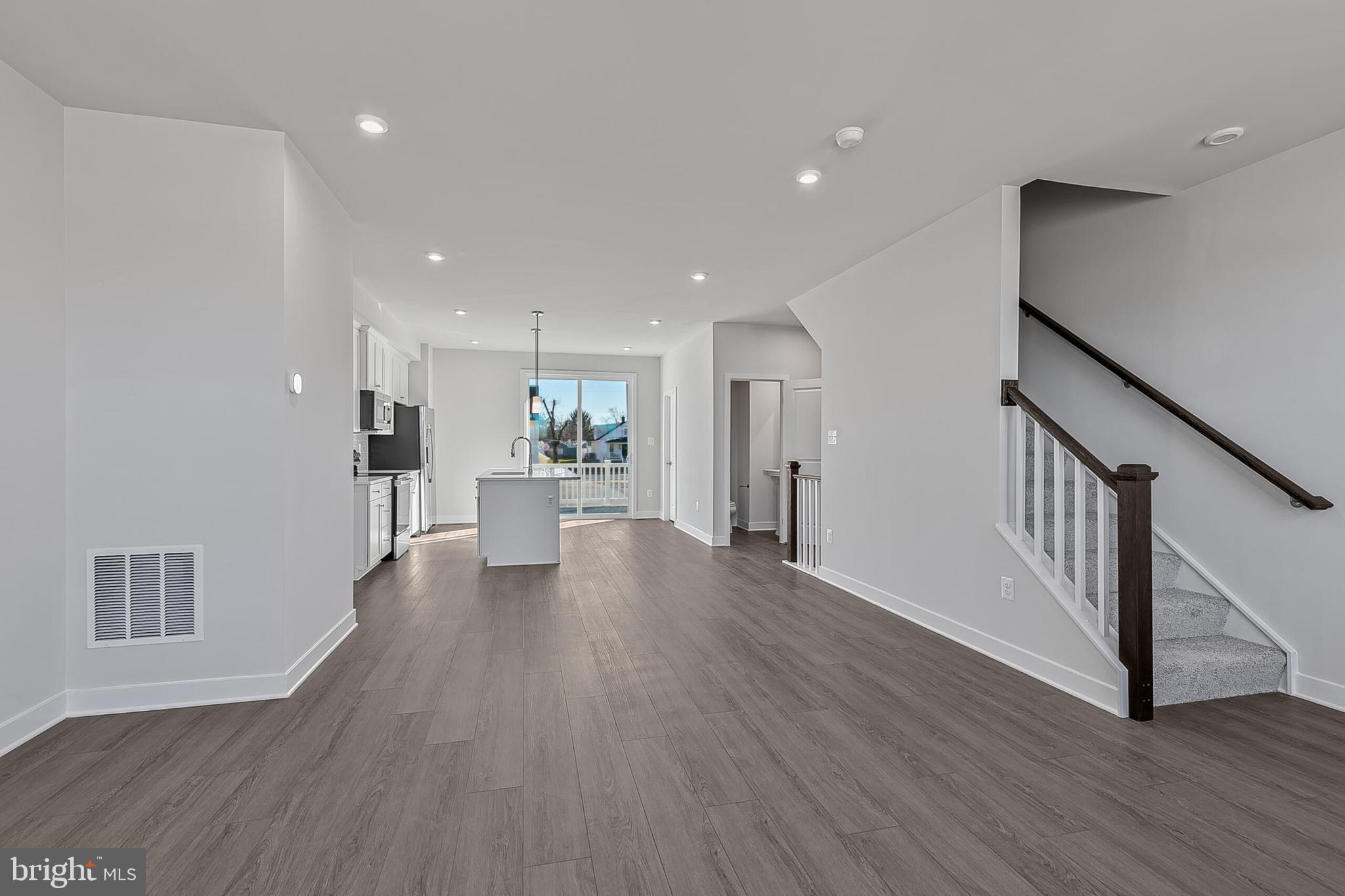 70 C Oasis Avenue Ranson, WV 25438 - Photo 20 of 41 a view of a big room with wooden floor and windows
